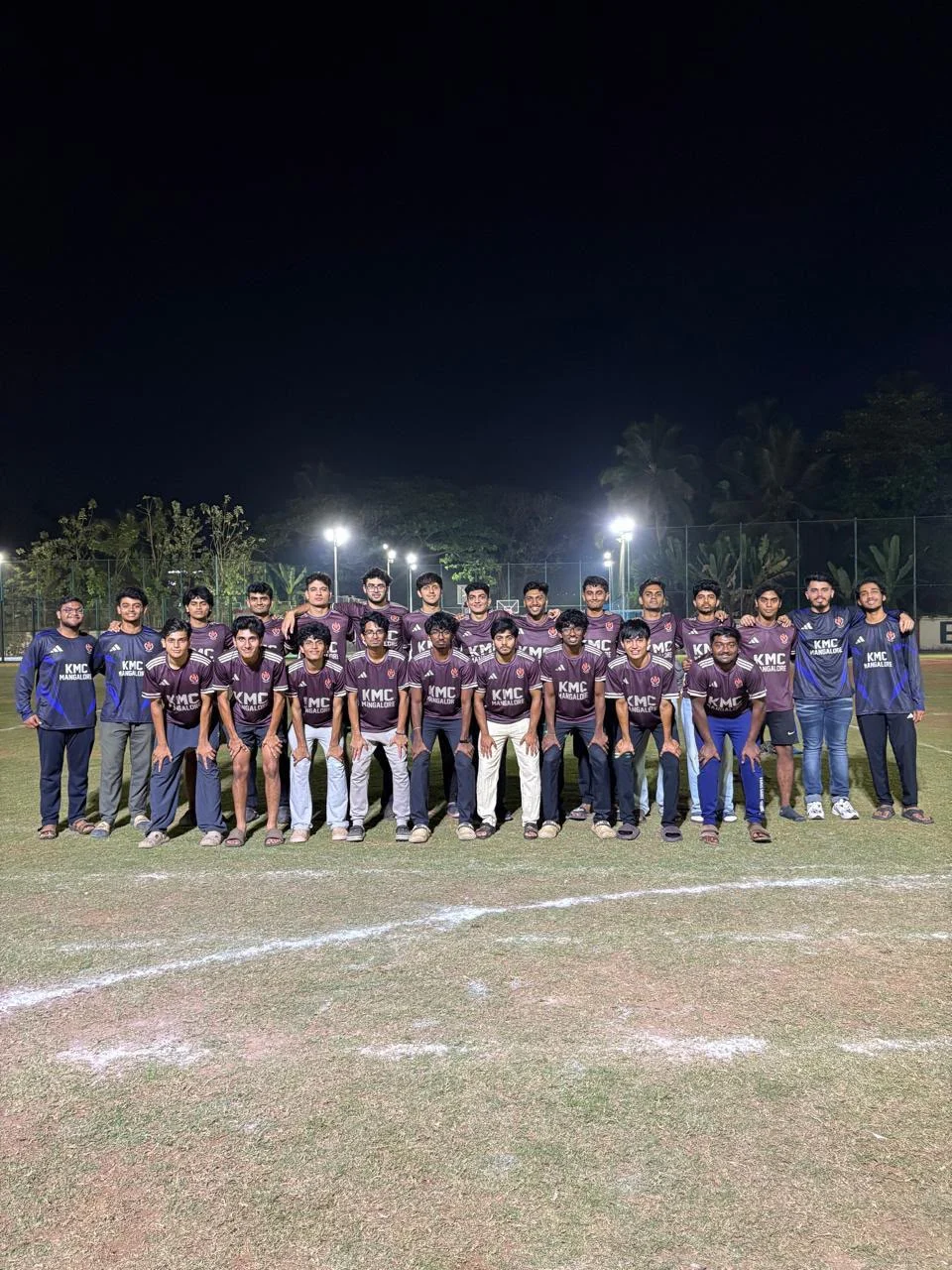 Cricket team wearing coordinated maroon jerseys